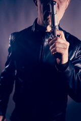 Black leather jacket hitman spy with gun
