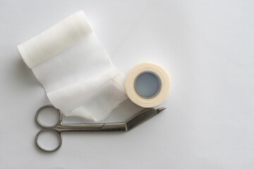 Dressing or clean wound tools includes Roll gauze,pile of gauzes and gauze roll cutter or scissors
