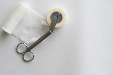 Dressing or clean wound tools includes Roll gauze,pile of gauzes and gauze roll cutter or scissors