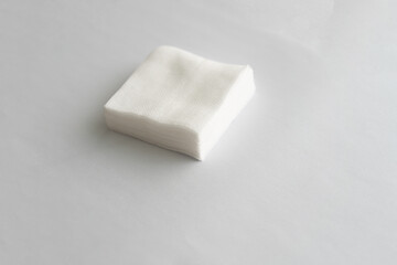 Stack of sterile gauze pad on dark background