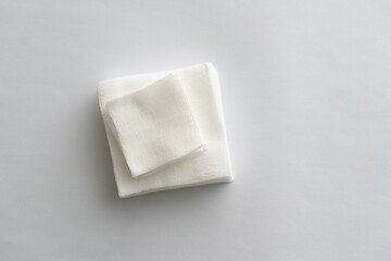 Gauze in square shape multiple size isolated on blue background,top view