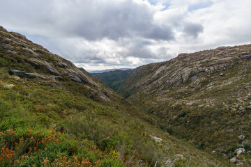 Fototapeta na wymiar Mountain landscape of granite rocks with green vegetation, Peneda-Geres National Park, Vilar da Veiga, Portugal