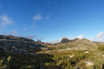Obraz premium Granite rock formation in mountain landscape during golden hour sunset at Cabana Meda de Rocalva, Peneda-Geres National Park, Vilar da Veiga, Portugal