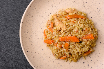 Delicious Uzbek pilaf with chicken, carrots, barberry, spices and herbs