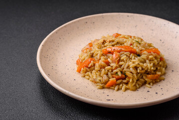 Delicious Uzbek pilaf with chicken, carrots, barberry, spices and herbs