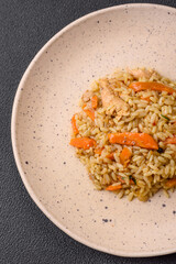 Delicious Uzbek pilaf with chicken, carrots, barberry, spices and herbs