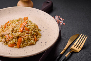 Delicious Uzbek pilaf with chicken, carrots, barberry, spices and herbs