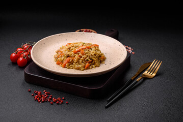 Delicious Uzbek pilaf with chicken, carrots, barberry, spices and herbs
