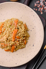 Delicious Uzbek pilaf with chicken, carrots, barberry, spices and herbs