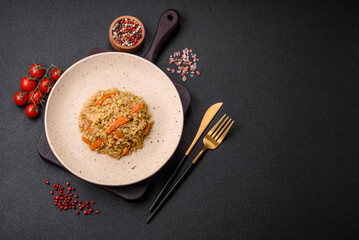 Delicious Uzbek pilaf with chicken, carrots, barberry, spices and herbs