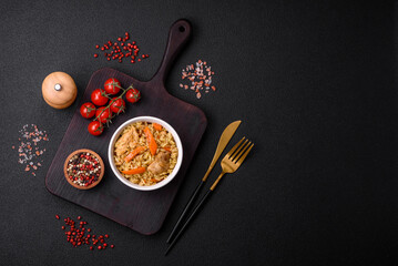 Delicious Uzbek pilaf with chicken, carrots, barberry, spices and herbs