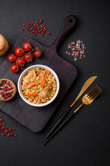 Delicious Uzbek pilaf with chicken, carrots, barberry, spices and herbs