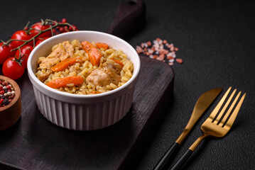 Delicious Uzbek pilaf with chicken, carrots, barberry, spices and herbs
