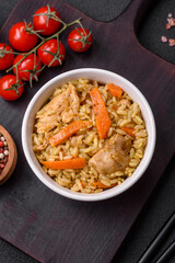 Delicious Uzbek pilaf with chicken, carrots, barberry, spices and herbs