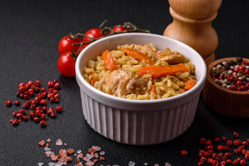 Delicious Uzbek pilaf with chicken, carrots, barberry, spices and herbs