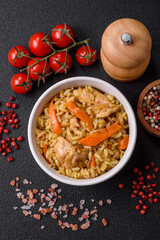 Delicious Uzbek pilaf with chicken, carrots, barberry, spices and herbs