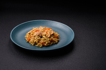 Delicious Uzbek pilaf with chicken, carrots, barberry, spices and herbs