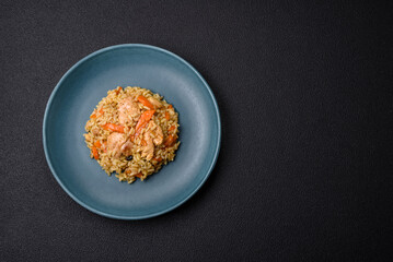 Delicious Uzbek pilaf with chicken, carrots, barberry, spices and herbs