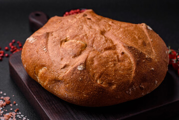 Delicious fresh crispy brown bread with seeds and grains