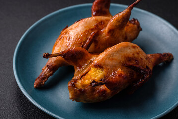 Roasted quail, partridge or pigeon stuffed with orange with spices and herbs