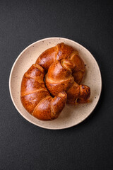 Delicious baked crispy croissants as an element of an invigorating, nutritious breakfast