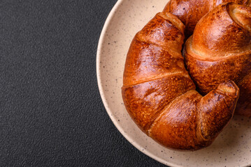 Delicious baked crispy croissants as an element of an invigorating, nutritious breakfast