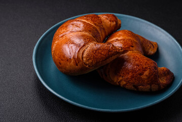 Delicious baked crispy croissants as an element of an invigorating, nutritious breakfast