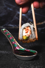 sushi with chopsticks