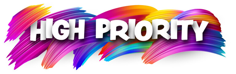 High priority paper word sign with colorful spectrum paint brush strokes over white.