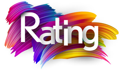 Rating paper word sign with colorful spectrum paint brush strokes over white.