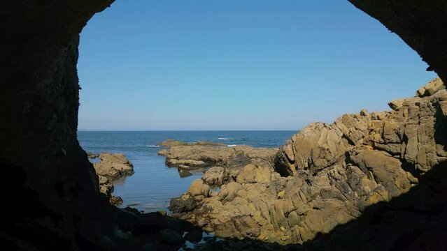 Coastal Cave With Sea View On the Coast Of Caion In Coruna, Spain. pullback