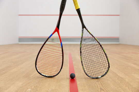 Closeup squash game racquet and ball training equipment