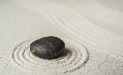 Foto op Plexiglas Stenen in het zand Black zen stone on sand round ripple