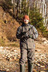 fisherman fishing on the river bank, Fishing rod, spinning