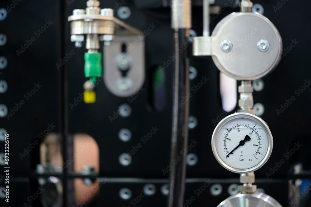 Poster pressure gauges mounted on the pipeline. measuring instruments for pressure control. industrial conc