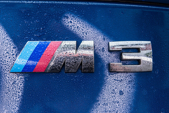 Lindesnes, Norway - June 20 2023: BMW M3 logo on a blue E46 car.