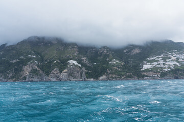 view of the Amalfi coast, Italy as seen from a boat on the Mediterranean Sea