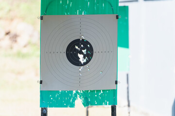 A shooting target that has been shot by a shooter in a shooting range.