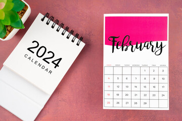 February 2024 calendar page with plant pot. - obrazy, fototapety, plakaty