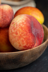 Fototapeta na wymiar ripe delicious peaches on the table, making desserts