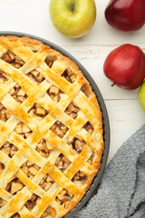 Homemade sweet american apple pie with sugar and cinnamon. Tart with apple on white background. Vertical photo
