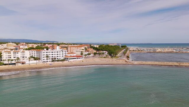 Aerial drone view of the coastal town in Spain named L'Hospitalet de l'infant