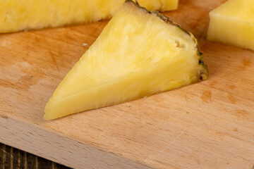 ripe yellow pineapple cut into pieces