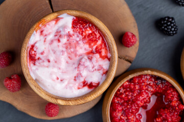 fresh yogurt with crushed juicy raspberries of red color