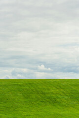 simple natural landscape with big sky and little green grass