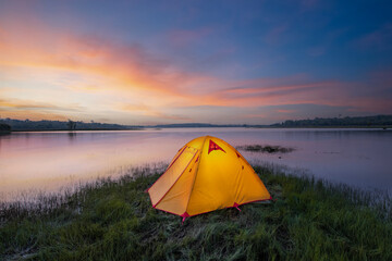 Yellow tourist tent, camping near Tha Krabak reservoir Sa Kaew Province, Thailand.