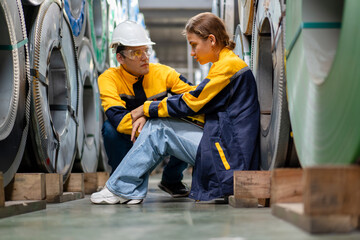 tired female worker feeling sick after stressed work in manufacturing factory, exhausted woman technician has problem working overload, male foreman support consoling and encorage at metal warehouse - obrazy, fototapety, plakaty