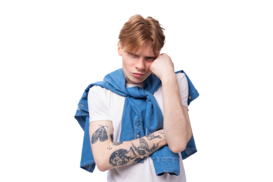 young red-haired guy in a blue shirt is brainstorming