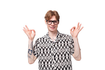 young smart red-haired caucasian man with glasses for vision in a summer short-sleeved shirt in black and white