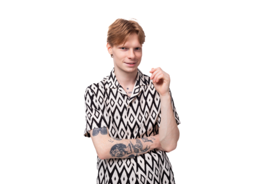 young smart man with red hair dressed in a short sleeve shirt posing on a white background